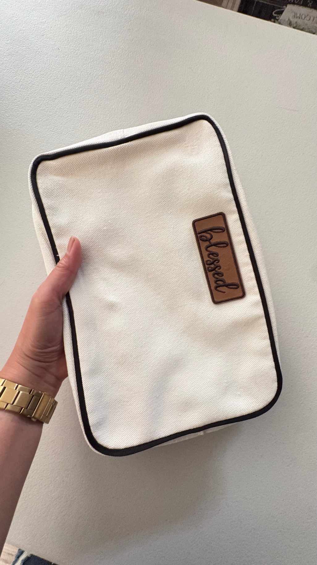 Blessed Bible Bag held in hand showing leather blessed patch