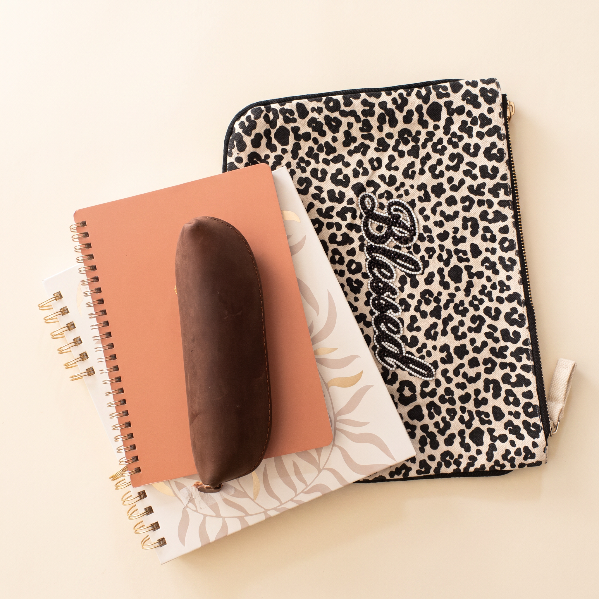 Blessed leopard pouch with journals and a leather pen case